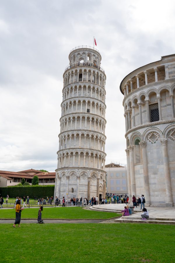 leaning tower of pisa as seen from the ground level behind the duomo