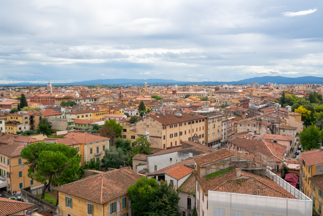 view from the top of the leaning tower of pisa on an october day in italy