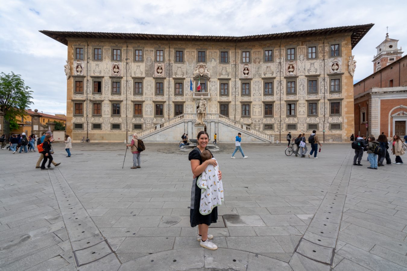 kate storm in piazza dei cavalieri while holding her baby during a florence to pisa day trip