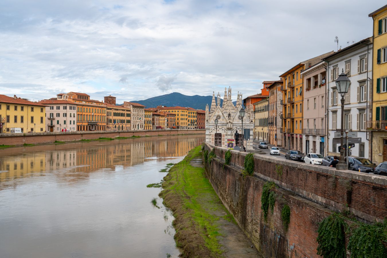 view of arno river in pisa italy with gothic santa maria della spina visible on the right bank